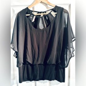 Pretty top with sheer overlay style & flattering waist band. Size XL never worn!